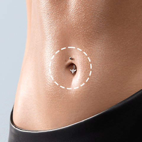 Piercing de nombril avec bijou serti, zone de perçage entourée d'un cercle en pointillés